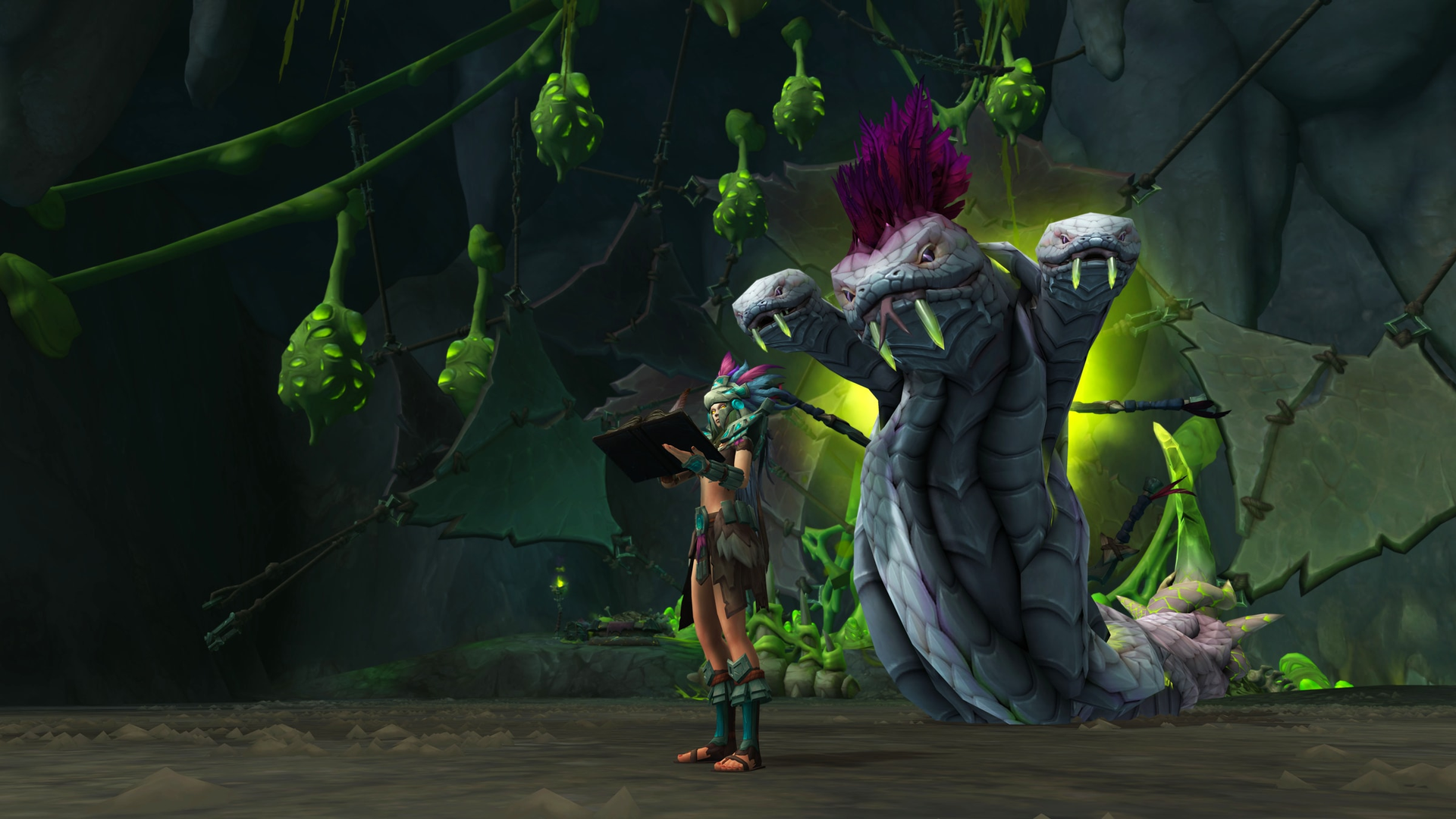World of Warcraft hotfix blog header — a Zandalari character reading a tome before a three-headed hydra in a green-lit cavern